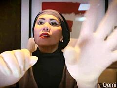 nurse snaps on latex gloves for patient's asmr checkup