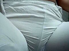 Close-Up View of Woman Urinating from Spread Pussy Lips in Detail