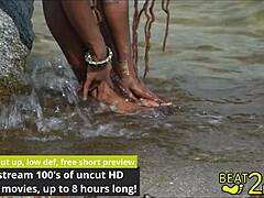 Giggles' feet soaked wet beachside