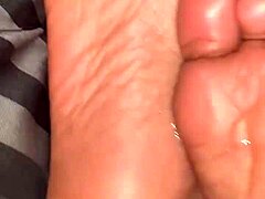 Hidden glimpses of those tempting ebony soles up close