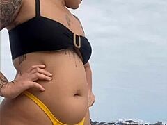 wanna see this yellow bikini splitting my swollen black pussy on the beach?