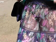 Does this hairy mature's see-through dress reveal her chubby beaver for outdoor flashing thrills?