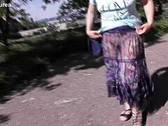 Does this hairy mature's see-through dress reveal her chubby beaver for outdoor flashing thrills?