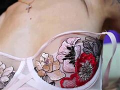 Pretty tattooed girl squirts wet pussy close-up with powerful vibrator in mirror