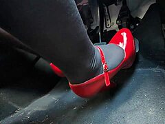 Redhead pumps pedals in sexy heels rushing to office job
