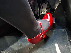 Redhead pumps pedals in sexy heels rushing to office job