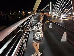 luscious curvy milf struts braless pantyless on bridge flashing huge tits