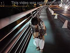 luscious curvy milf struts braless pantyless on bridge flashing huge tits