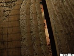 Watch this busty lesbian slave stroke her big tits in tight bondage!