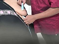 Doctor Examines Hijab-Wearing Arab Patient in Hospital Setting Closely