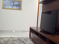 Curvy Tanned Brazilian Housewife Flashes Shaved Pussy To TV Tech Barefoot