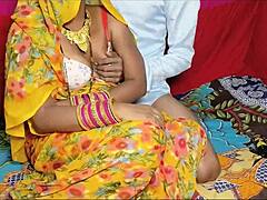 Desi village wife in yellow saree spreads hairy pussy for hard quickie fuck