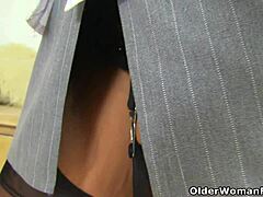 Hey British granny Georgie stuffs dildos in her nylon arse and pussy