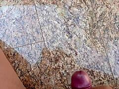 Brazilian dude jerks huge cock in garage and blasts massive load for exhibitionist fans