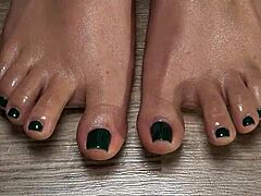 close up on my green nailed toes perfect for your secret fetish cravings