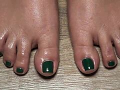 close up on my green nailed toes perfect for your secret fetish cravings