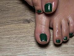close up on my green nailed toes perfect for your secret fetish cravings
