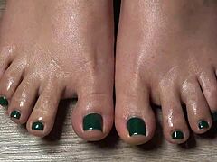 close up on my green nailed toes perfect for your secret fetish cravings