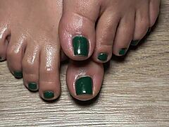 close up on my green nailed toes perfect for your secret fetish cravings