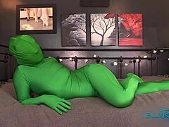 hidden figure teases in hooded full body green zentai suit