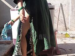 sexy indian milf bhabhi bathes her wet big boobs outside