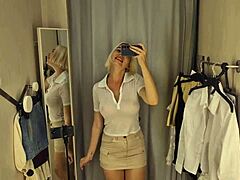 Sexy blonde teacher flashes big tits and shaved pussy in see-through uniform fitting room