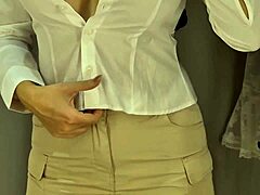 Sexy blonde teacher flashes big tits and shaved pussy in see-through uniform fitting room
