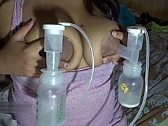 Milf's massive lactating tits pumped full and milked dry