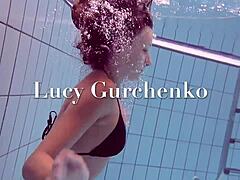 Lucy Boldly Strips Bikini in Teasing Pool Splash