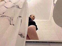 the cute redhead beauty fingers her wet pussy in shower all day long