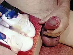 the hot slut's pussy and toes get sprayed with cum in close-up