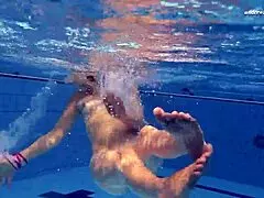 Elena Proklova shines as an underwater blonde beauty.