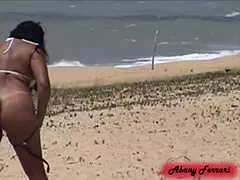 She’s just showing off her pussy in a thong at Porto Seguro beach