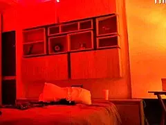 Linda Houston starts dancing in the red light, flaunting her big Latina ass and natural tits.