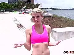 Athletic blonde stretches on the beach before bending over doggystyle for blowjob and facial cumshot.