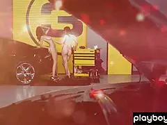 These big-boobed amateur mechanics are stripping down in the garage. Their shaved bodies look hot while undressing for fun.