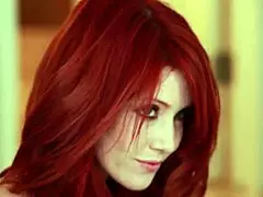 Elle Alexandra performs a redhead striptease solo