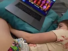 Eating snacks with my sister while using the computer in a nerdy setup.