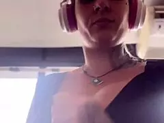 blonde with big tits trains at the gym, sweats heavily, sits to expose her breasts and breathe.