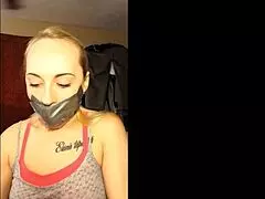Blonde slut bound and gagged in homemade tape.