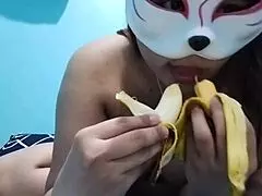 Busty Asian babe enjoys fruit fetish with banana in homemade video