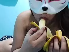 Busty Asian babe enjoys fruit fetish with banana in homemade video