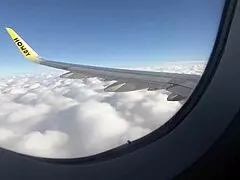 Teen brunette amateur sucks cock in outdoor airplane handjob, swallowing cumshot