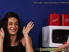 Clothed brunette watches the action 😏