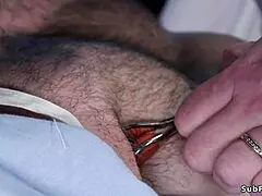 Dominant milf nurse ties up and strapon fucks her submissive patient.