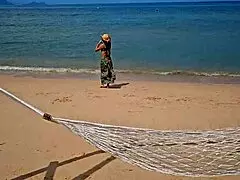 Woman Flashes On Public Beach