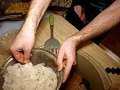 Yo, see this sexy gay chef cooking naked? He's making rice noodle with chicken and veggies!