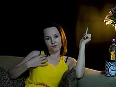 Wow, she's sucking on that cigarette while staring right at you!