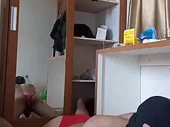 Sexy gay in red crossdresser outfit and mask engages in anal play