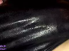 Transsexual in navy blue swimsuit gets coated with slippery lotion